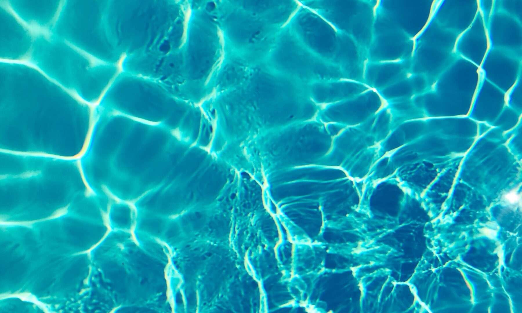 sun shining through water in a swimming pool