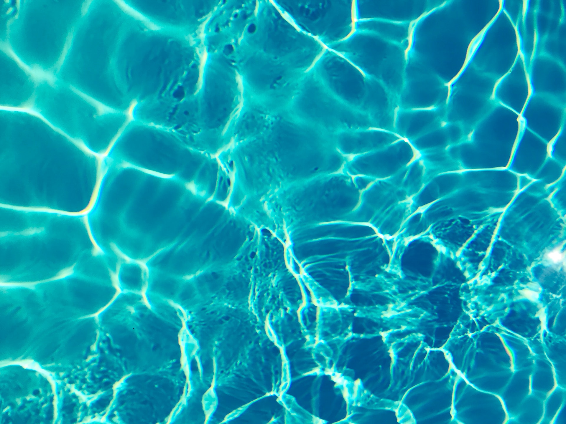 sun shining through water in a swimming pool