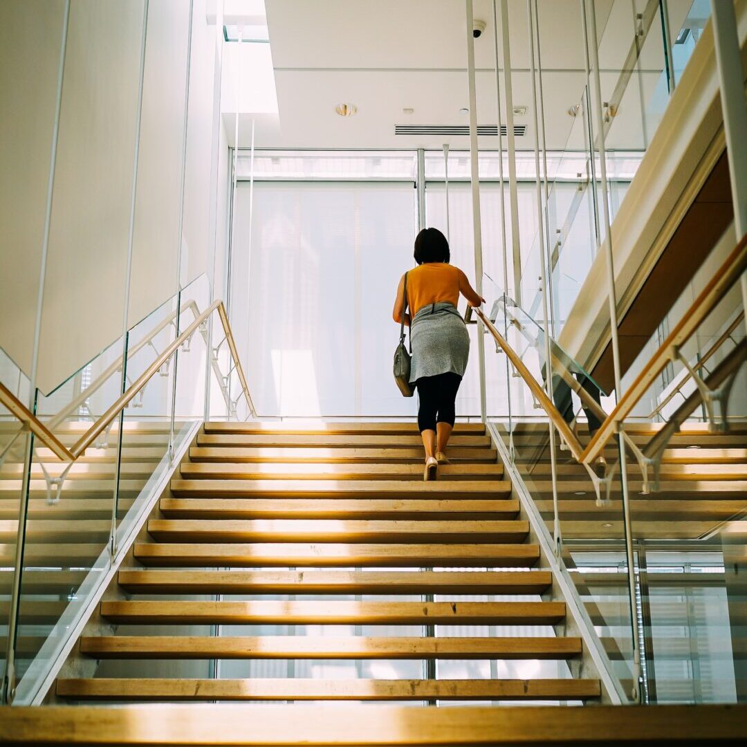 a woman climbing stairs