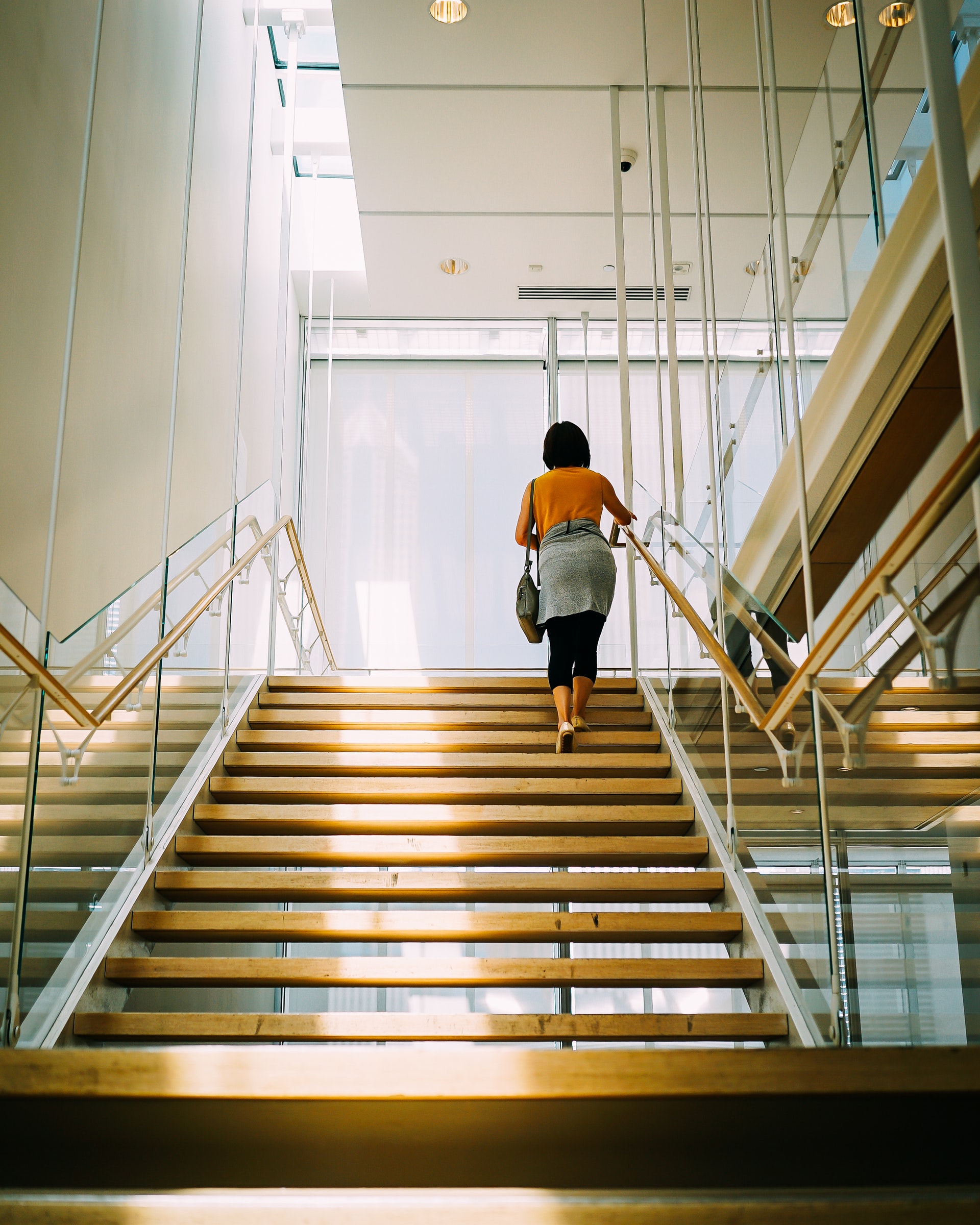 a woman climbing stairs