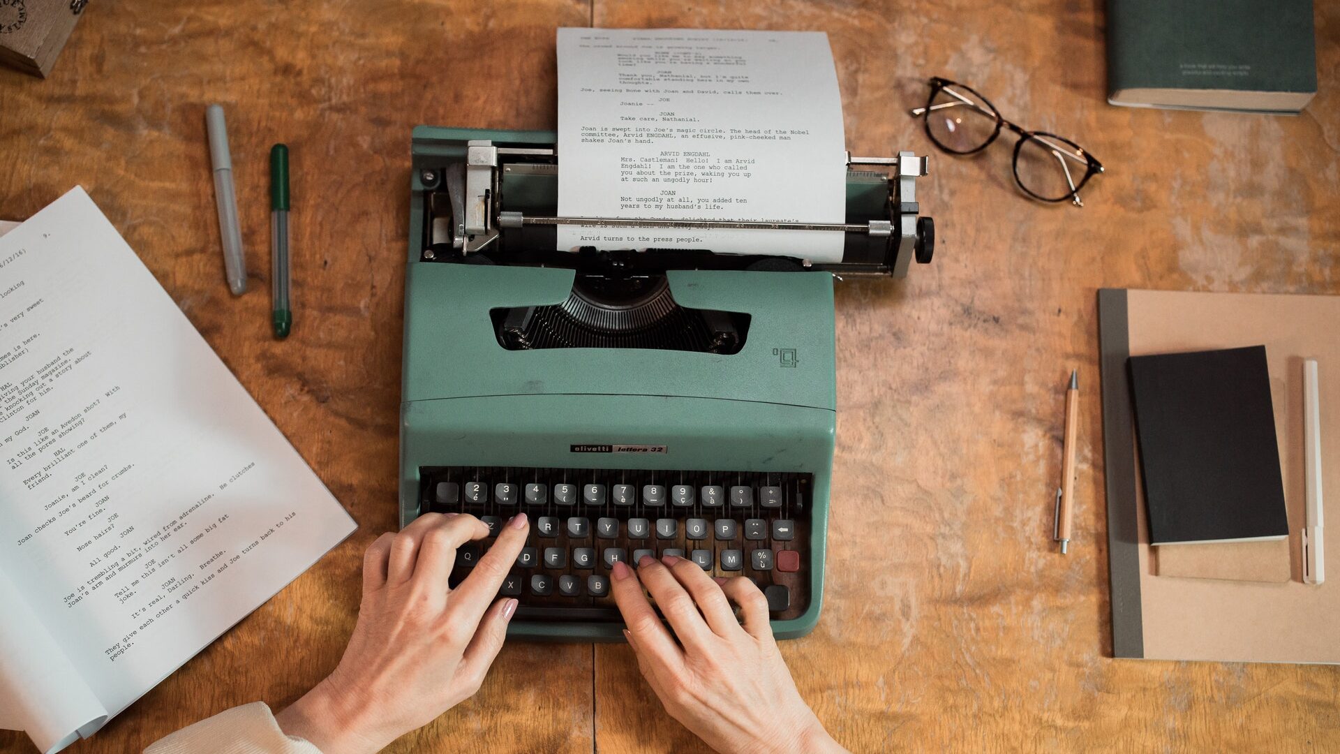 a white woman typing on a keyboard