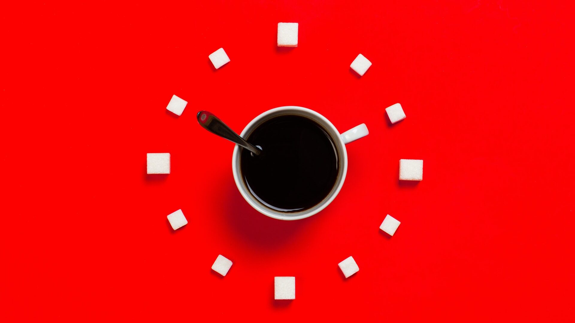 White Mug on Red Background that looks like a clock