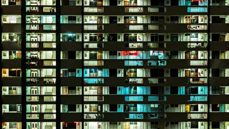 a close up on dozens of apartment balconies at night