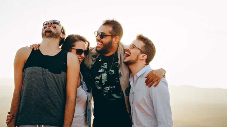 group of men and women smiling